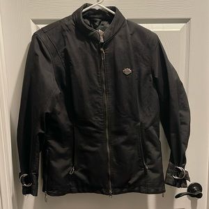 Harley-Davidson Women’s Jacket. Sz M 3 pockets. All zip. Cuff buckles.